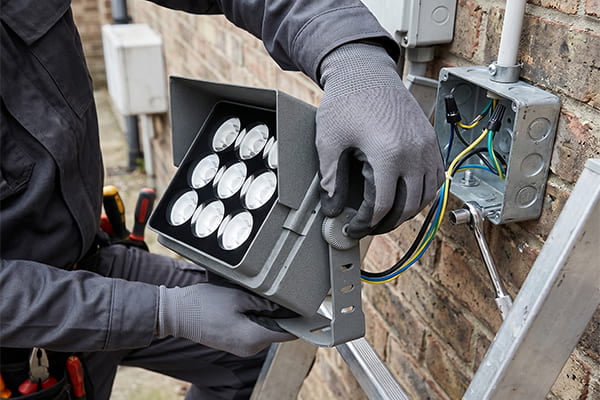 Installing an LED flood light with an adjustable bracket